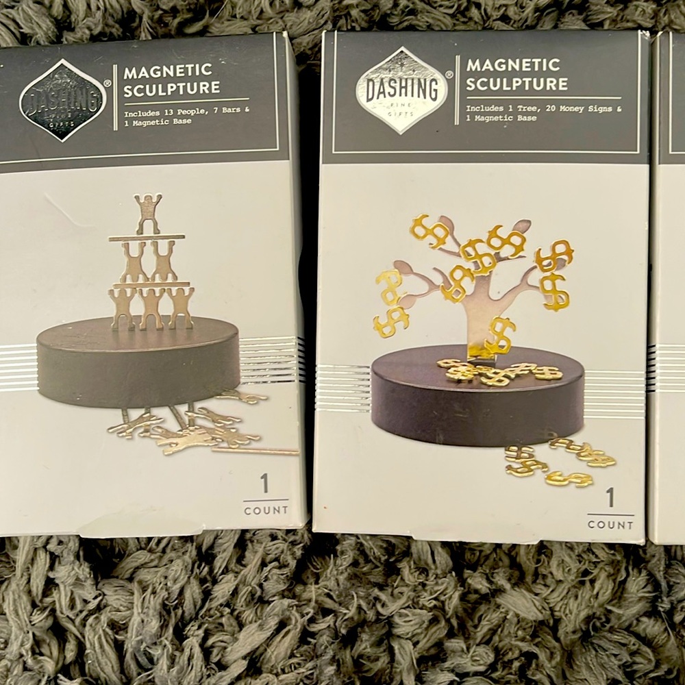 Magnetic sculpture, money, tree, and people